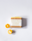 Calamansi Soap with 'Ives & Bees' branding and calamansi fruit on a white background