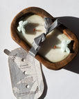 Diwata Wooden Bowl Candle in a wooden holder on a light background