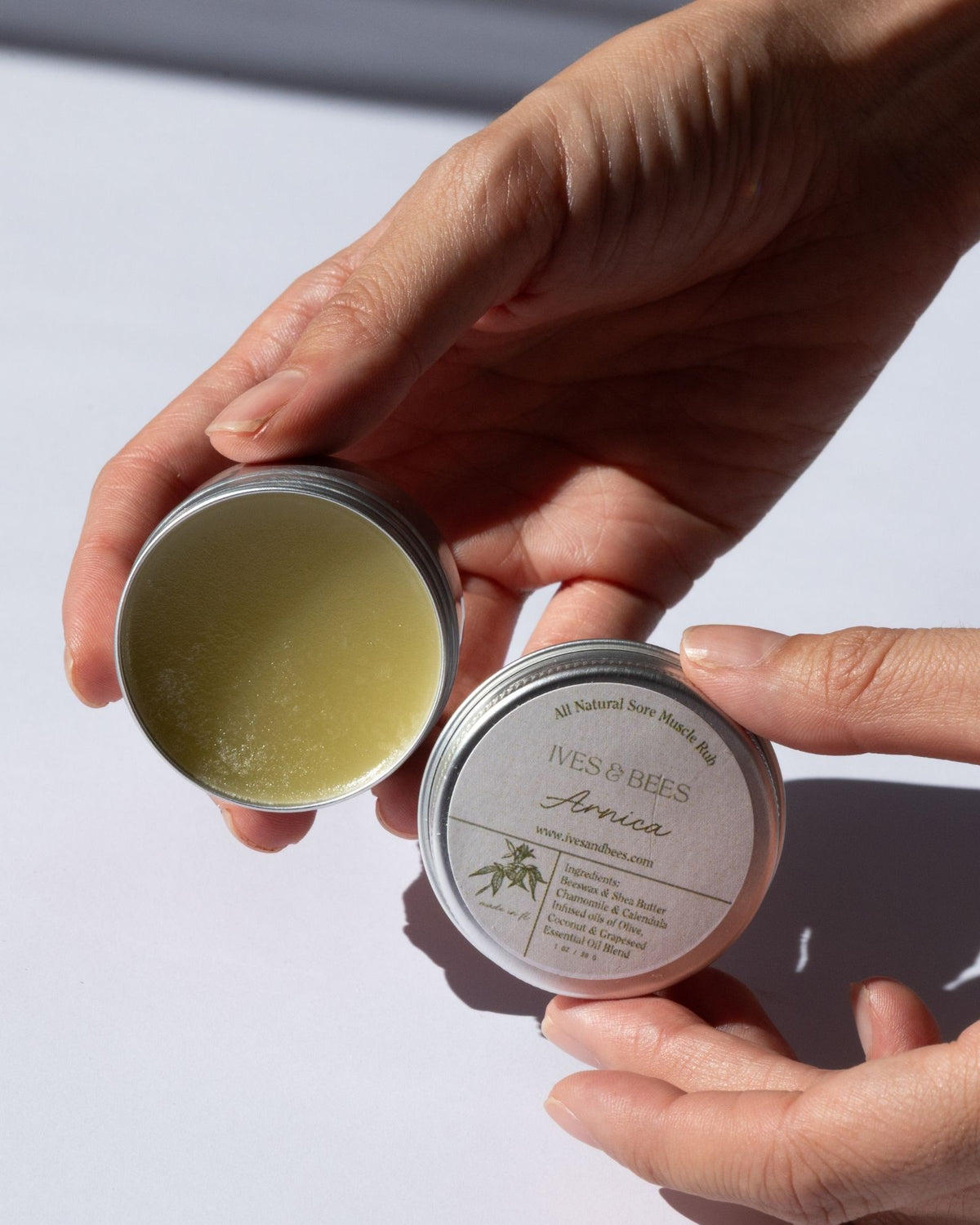 Person holdingArnica Salve