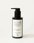 A bottle of Ives & Bees Plant-Based Body Lotion with a black pump dispenser and a white label, set against a plain white background.