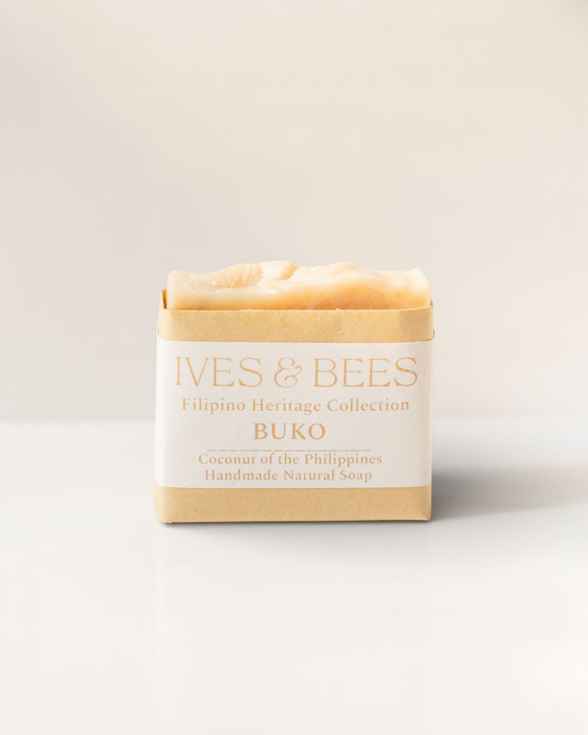 Buko soap in a brown paper wrap with 'Ives & Bees' branding on a light background