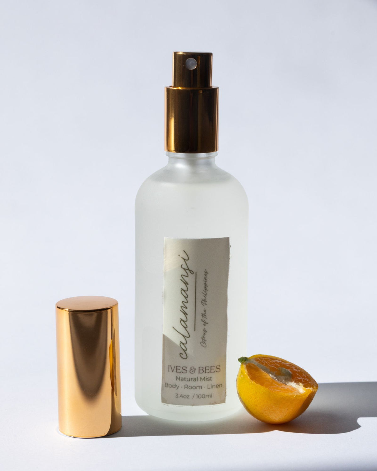 Handmade Natural Mist with gold cap and label on a white background