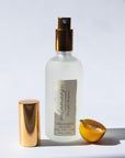 Handmade Natural Mist with gold cap and label on a white background