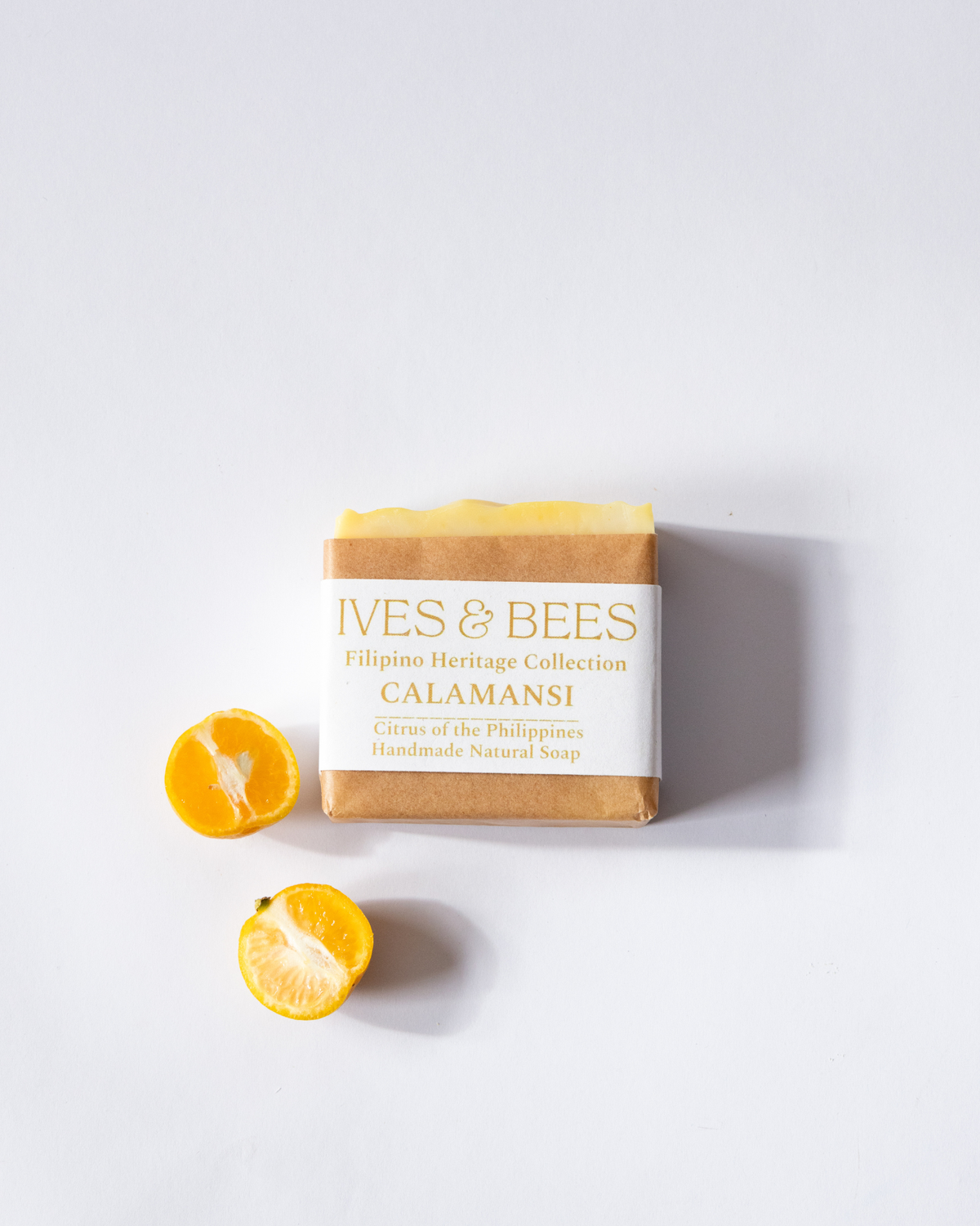 Calamansi Soap with 'Ives & Bees' branding and calamansi fruit on a white background