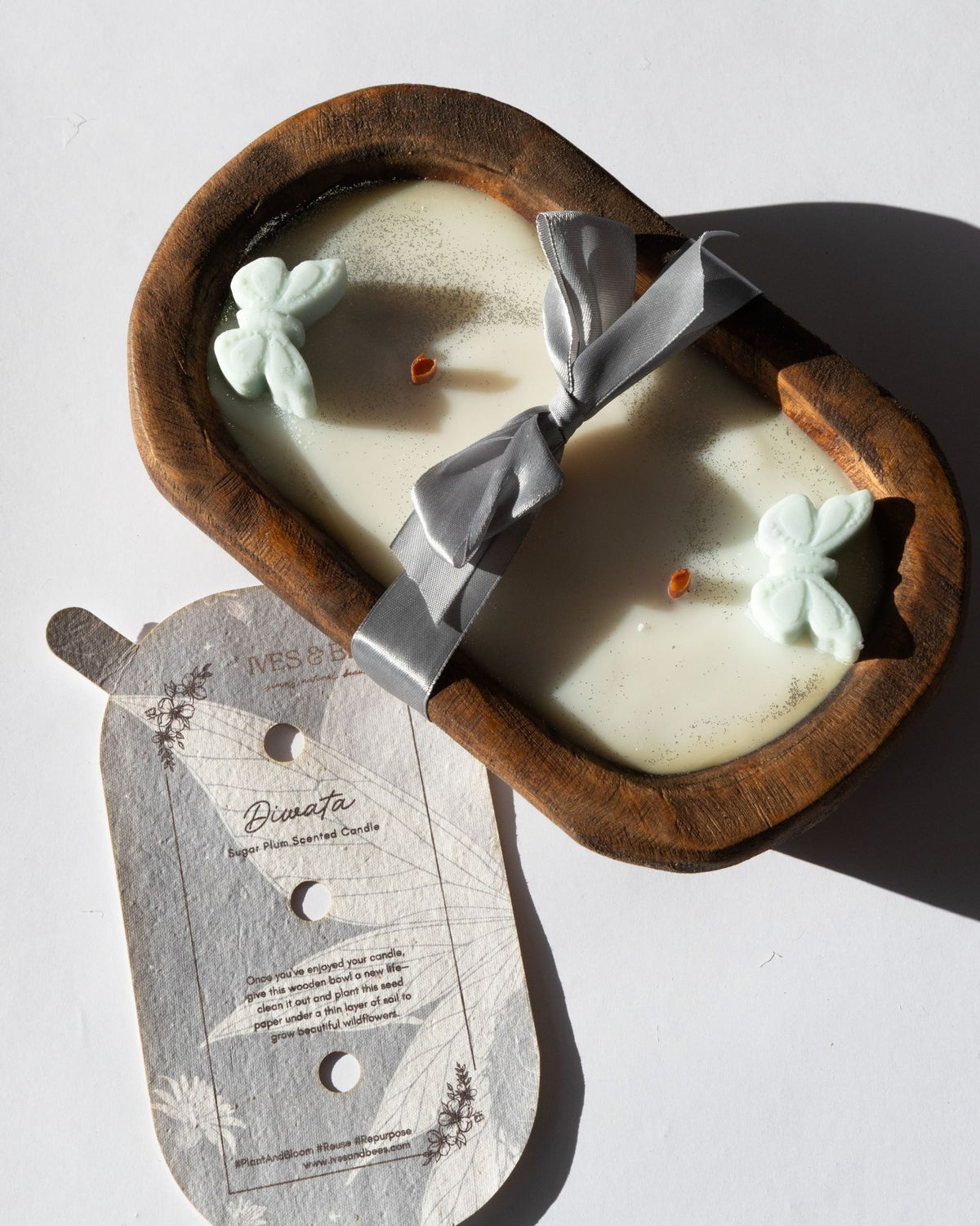 Diwata Wooden Bowl Candle in a wooden holder on a light background