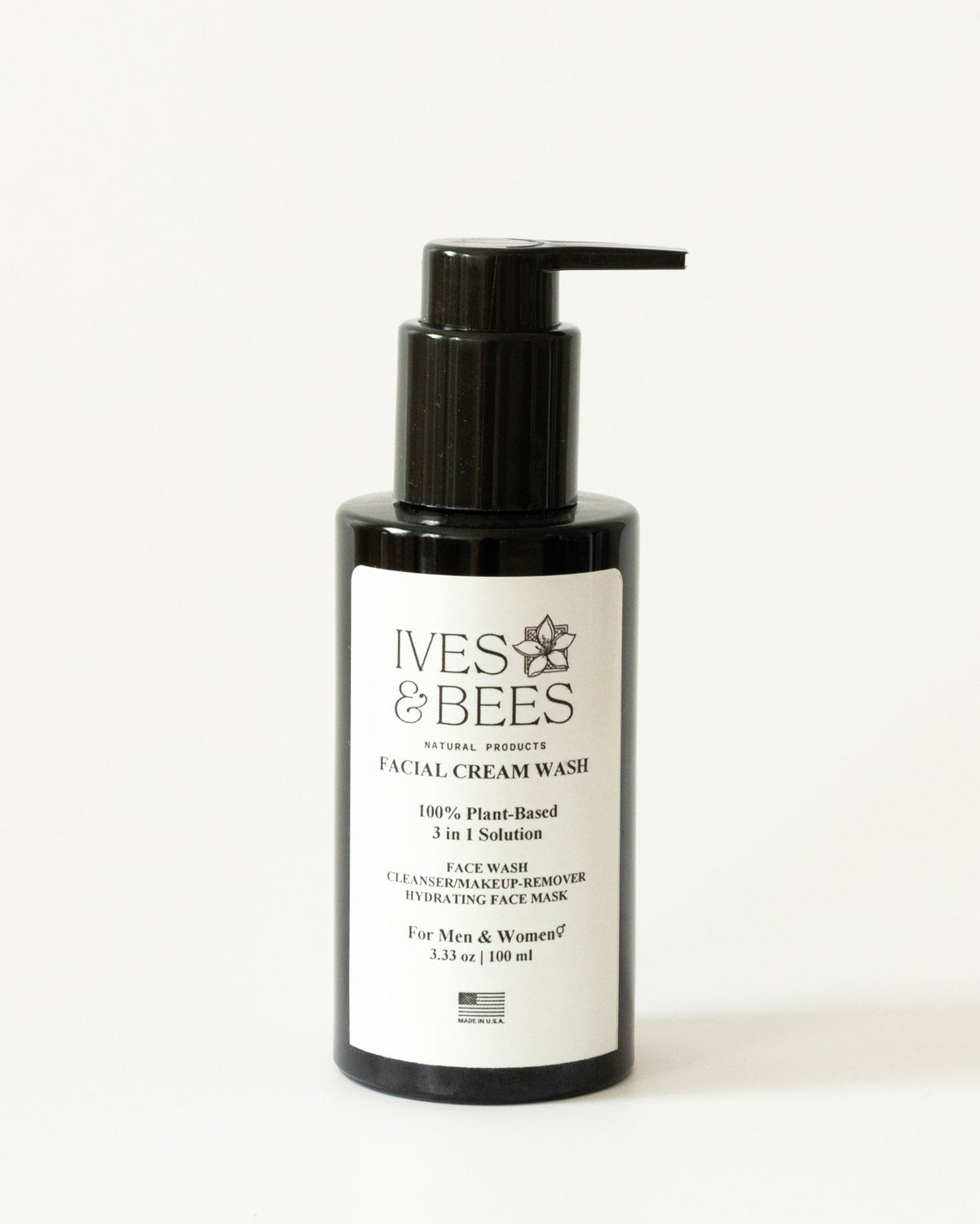 A black pump bottle of Ives & Bees Facial Cream Wash with a white label, set against a plain white background.