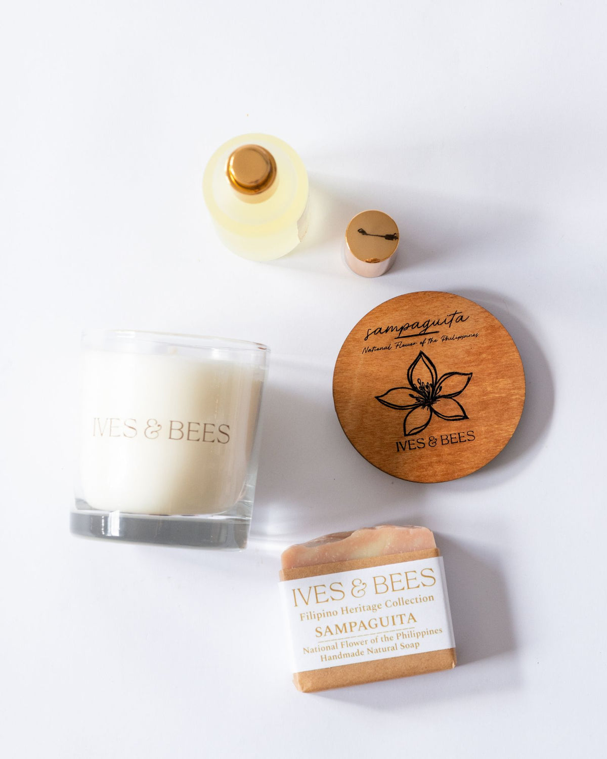 Handmade Filipino Heritage Sampaguita Gift Set including a candle, soap, and wooden coaster on a white background