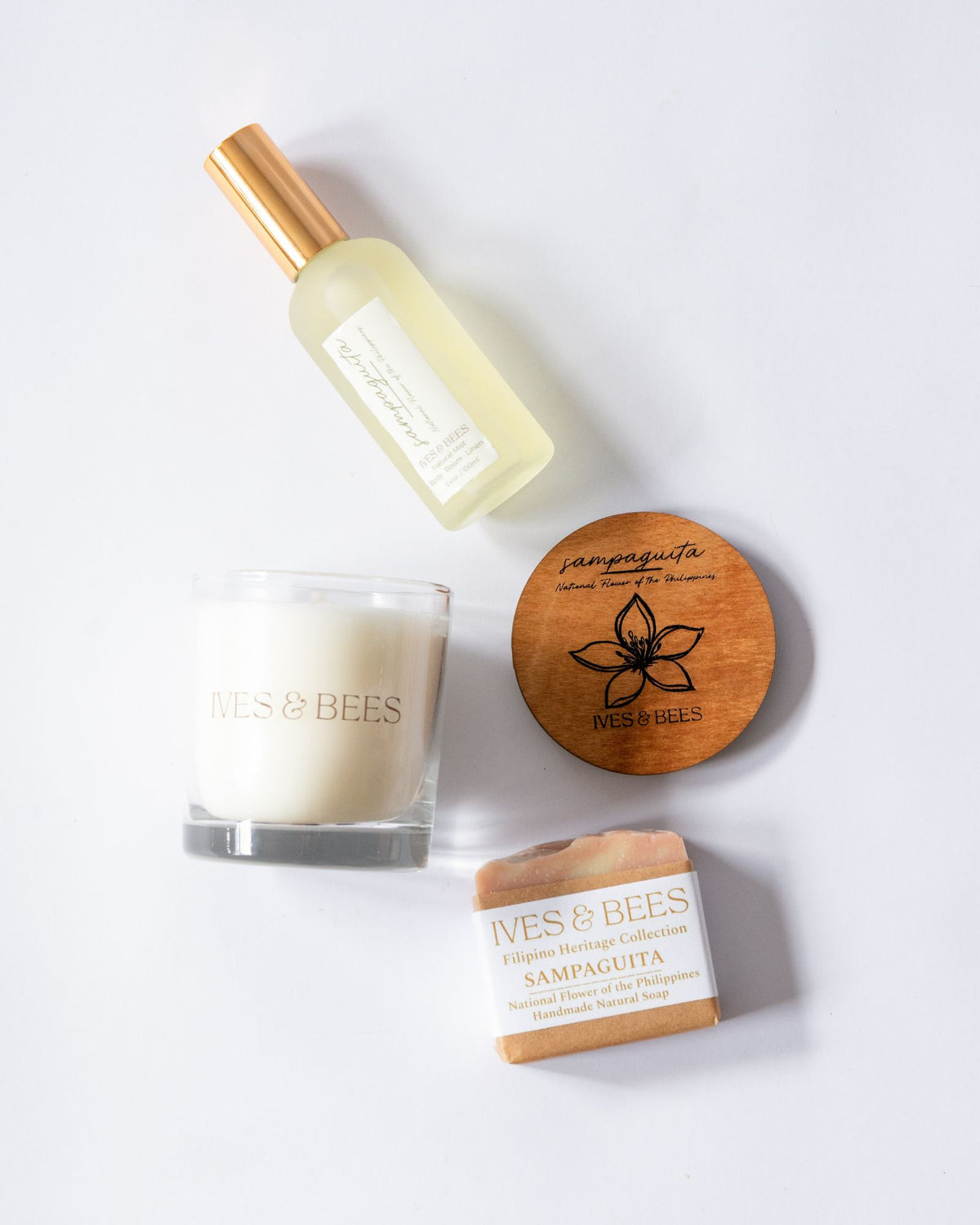 Handmade Filipino Heritage Sampaguita Gift products including a bottle, candle, and soap on a white background