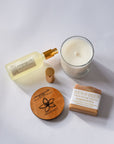 Handmade Filipino Heritage Sampaguita Gift skincare products including a candle, bottle, wooden lid, and soap on a white background