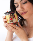Woman holding a Maganda Ka Candle.