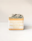 Handmade Orange Patchouli Soap with 'Ives & Bees' packaging on a white background