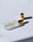 Handmade Natural Mist with gold cap on a light gray background