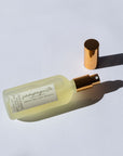 Handmade Natural Mist with gold cap on a light gray background