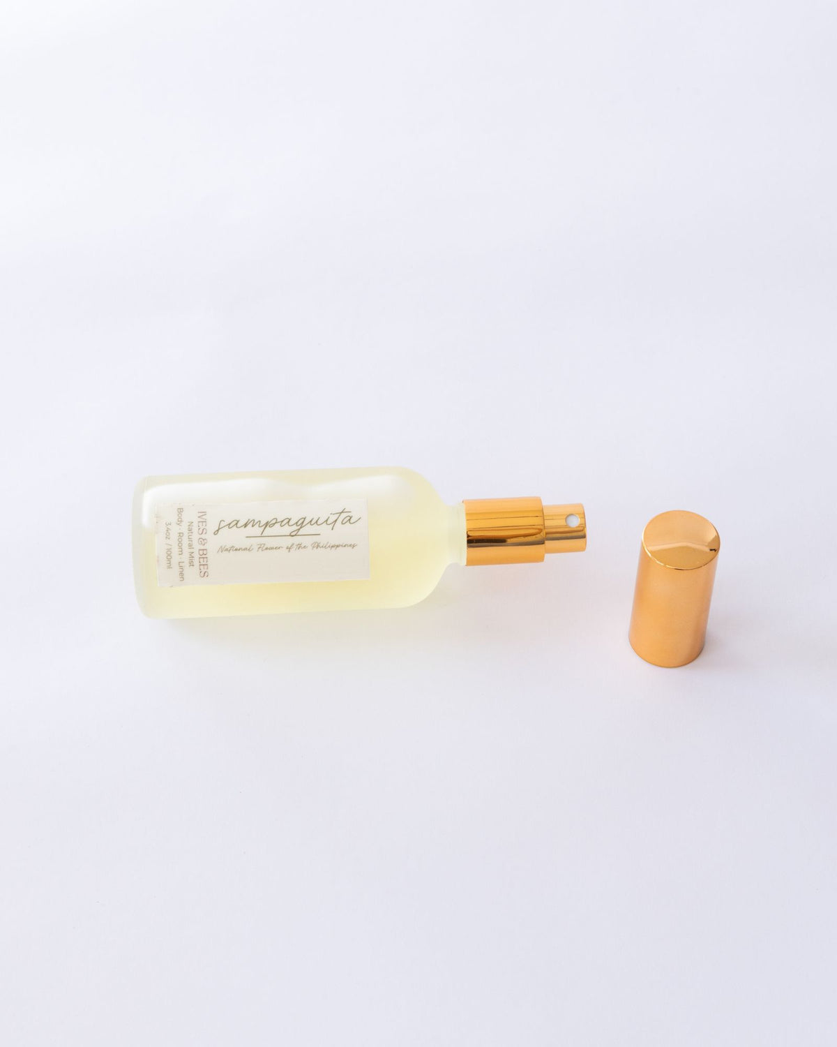 Handmade Natural Mist with gold cap and label on a white background
