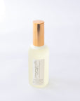 Handmade Natural Mist with gold cap on a white background